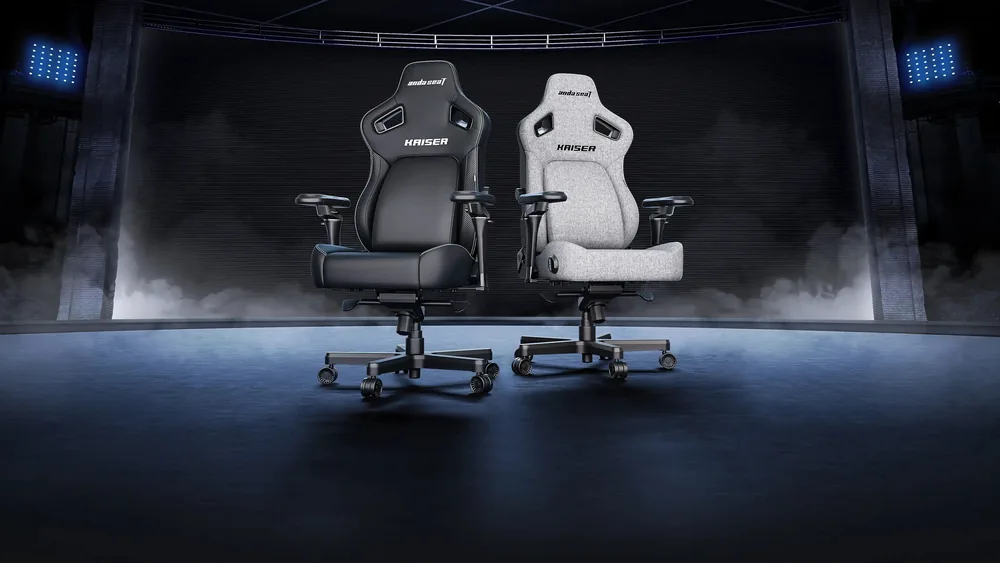 Sahnadagi ikkita AndaSeat Kaiser 4 V2 — qora eko-teri va kulrang zigʻir matoda