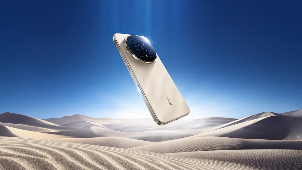HONOR Magic 8 Pro в цвете Sunrise Gold над песчаными дюнами